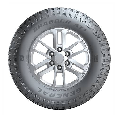 Nahaufnahme eines robusten Geländereifens mit silbernem Leichtmetallrad, beschriftet mit „GRABBER AT