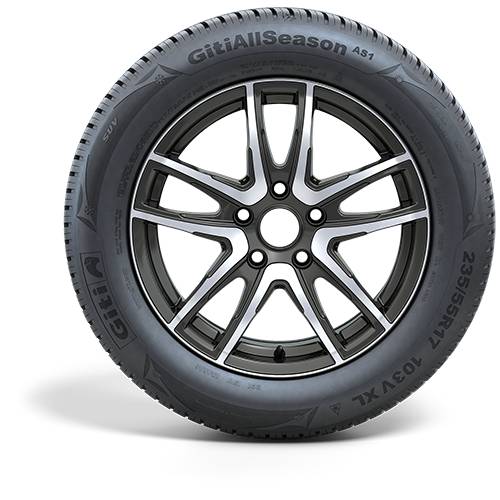 Autoreifen mit schwarzsilbernem Leichtmetallrad, frontal vor schwarzem Hintergrund abgebildet.