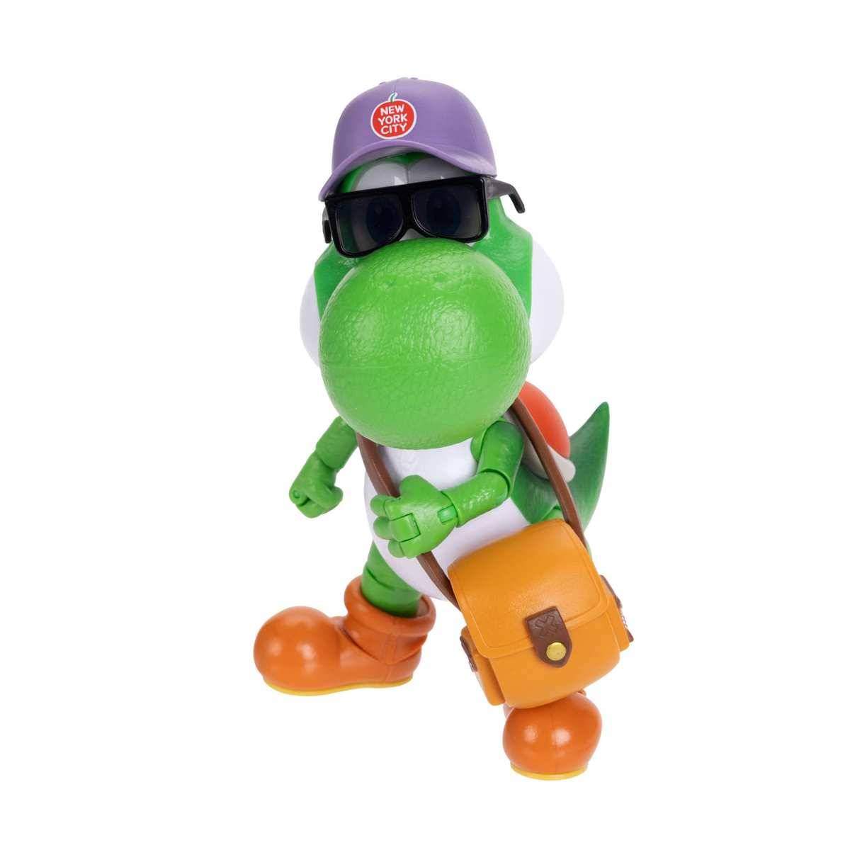 Grüne Spielzeug-Dinosaurier-Figur, die eine violette „New York City