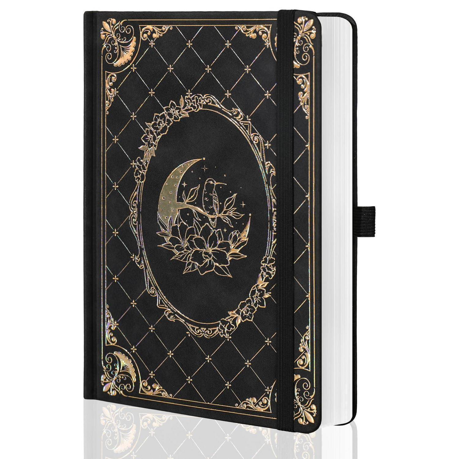 Schwarzes Hardcover-Notizbuch mit goldenem Blumen- und Halbmond-Design, elastischer Verschluss, geschlossen auf weißem Hintergrund dargestellt.