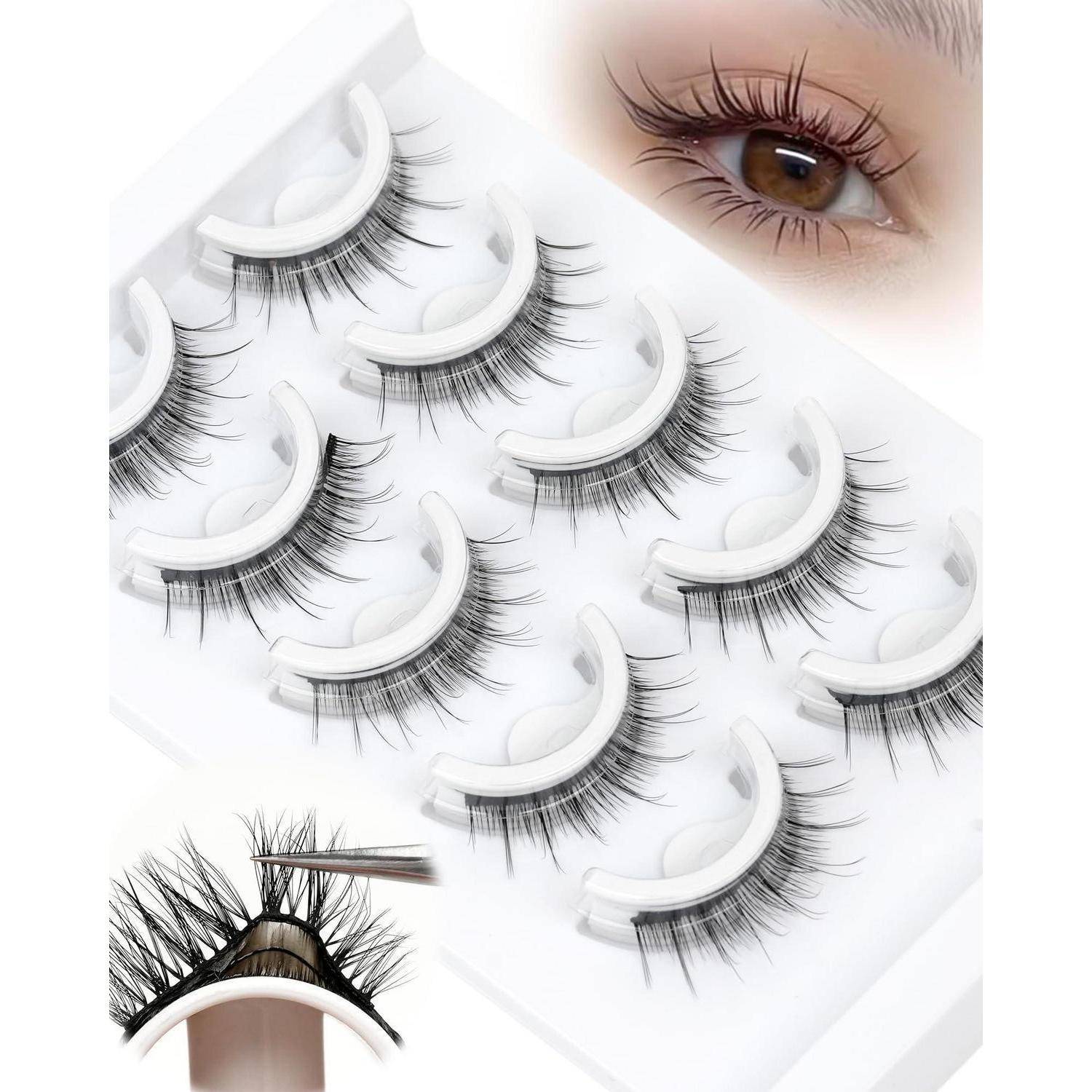 Künstliche Wimpern in weißen Tabletten mit nahaufnahmem Auge und einer Hand, die einen Wimpernstreifen mit einer Pinzette aufträgt, wobei die Wimpernverlängerungsanwendung gezeigt wird.