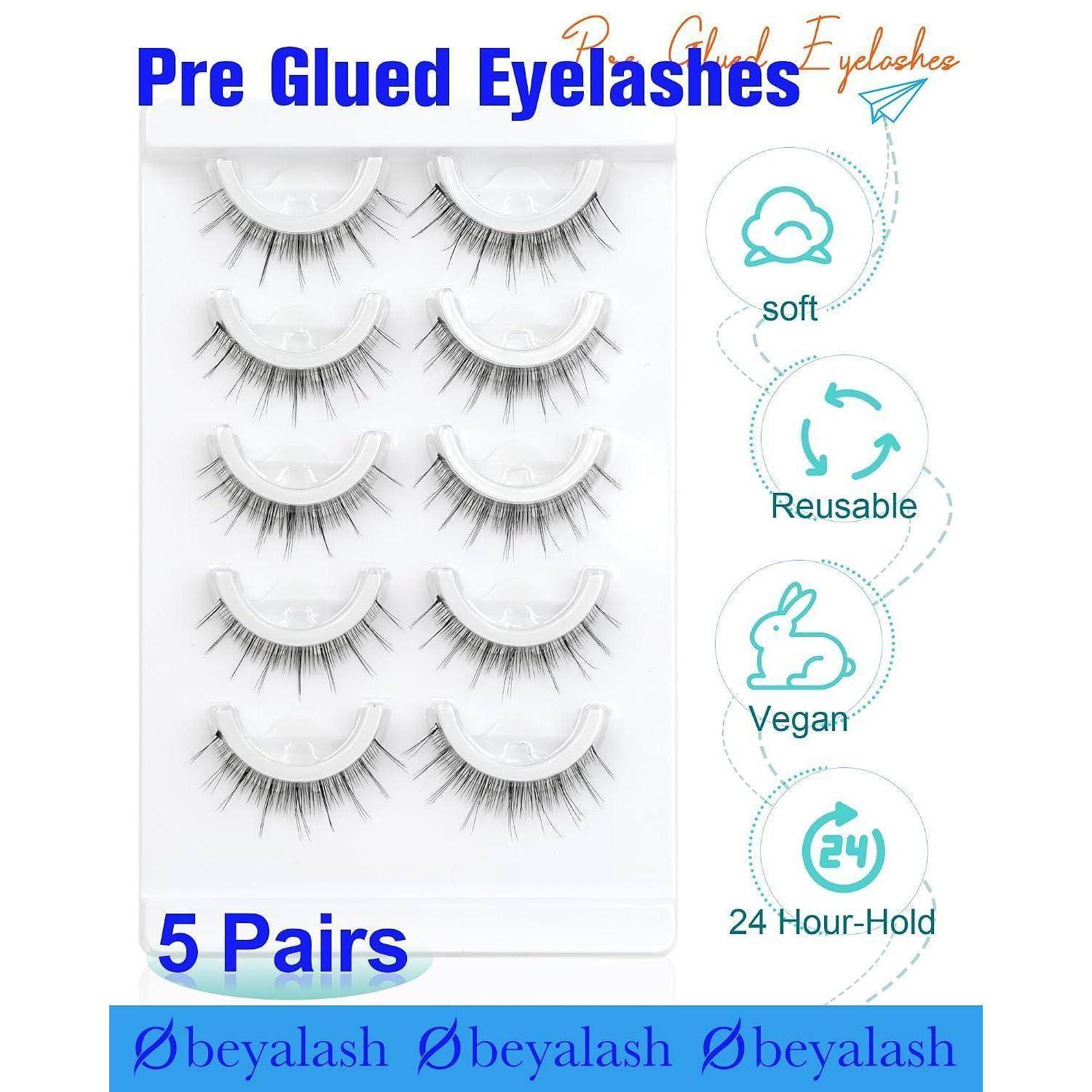 Produktbild von vorgeklebten künstlichen Wimpern, das 5 Paar in einer Schachtel zeigt, mit Beschriftungen „weich