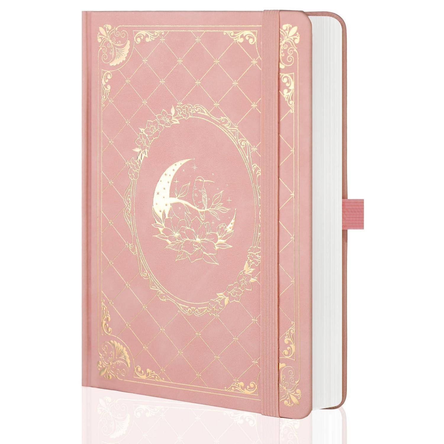 Rosa Hardcover-Journal mit goldenem Blumen- und Monddesign, geschlossen mit Lesezeichenband dargestellt.