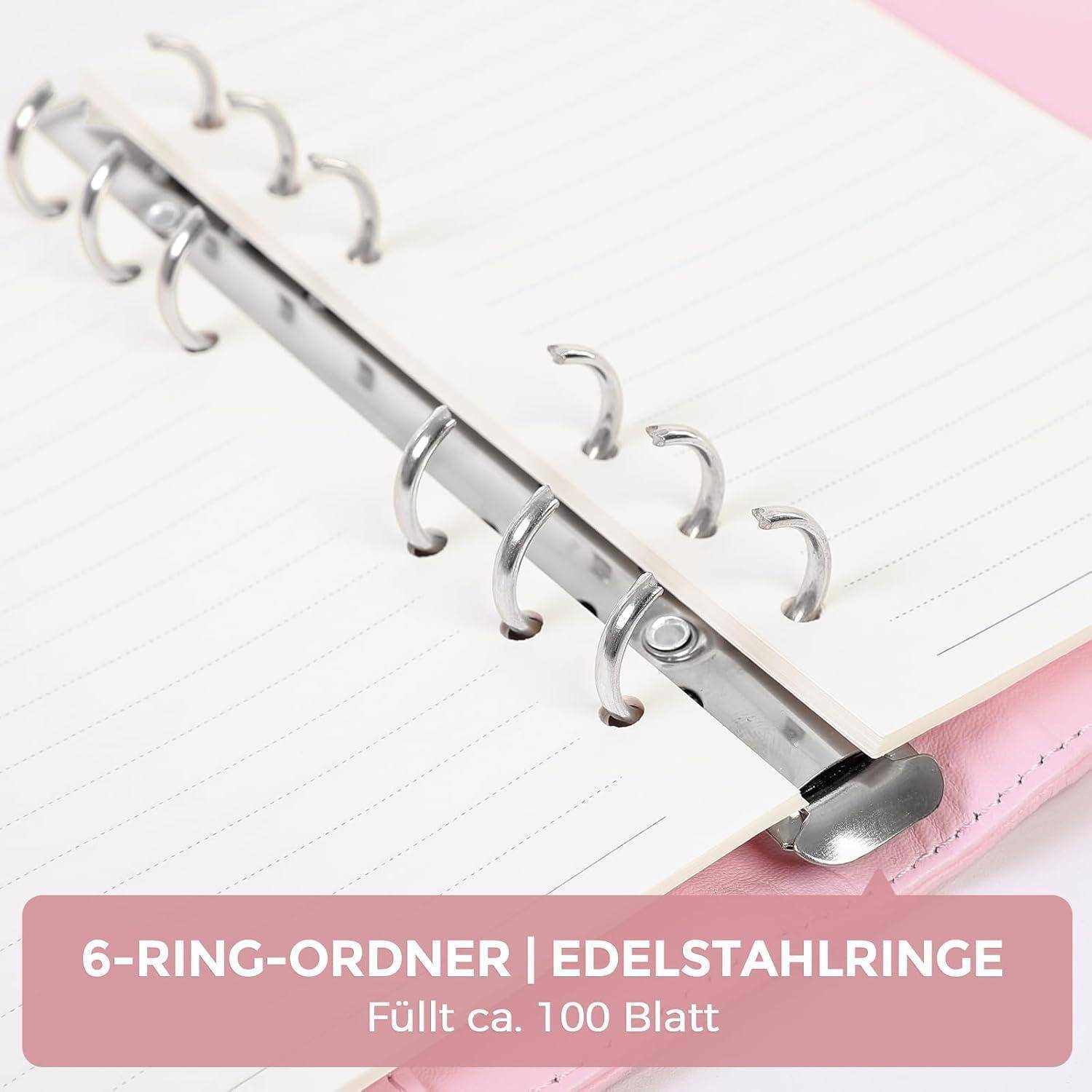Foto eines rosa 6er-Ringordners mit Edelstahlringen; der Text lautet „6-RING-ORDNER | EDELSTAHLRINGE