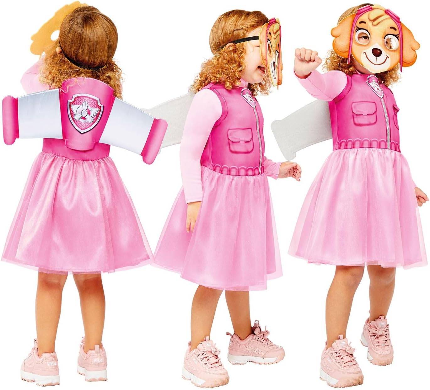 Kind, das ein rosa Welpenrettungskostüm mit Rucksack und Maske trägt, von hinten, von der Seite und von vorne auf weißem Hintergrund gezeigt.