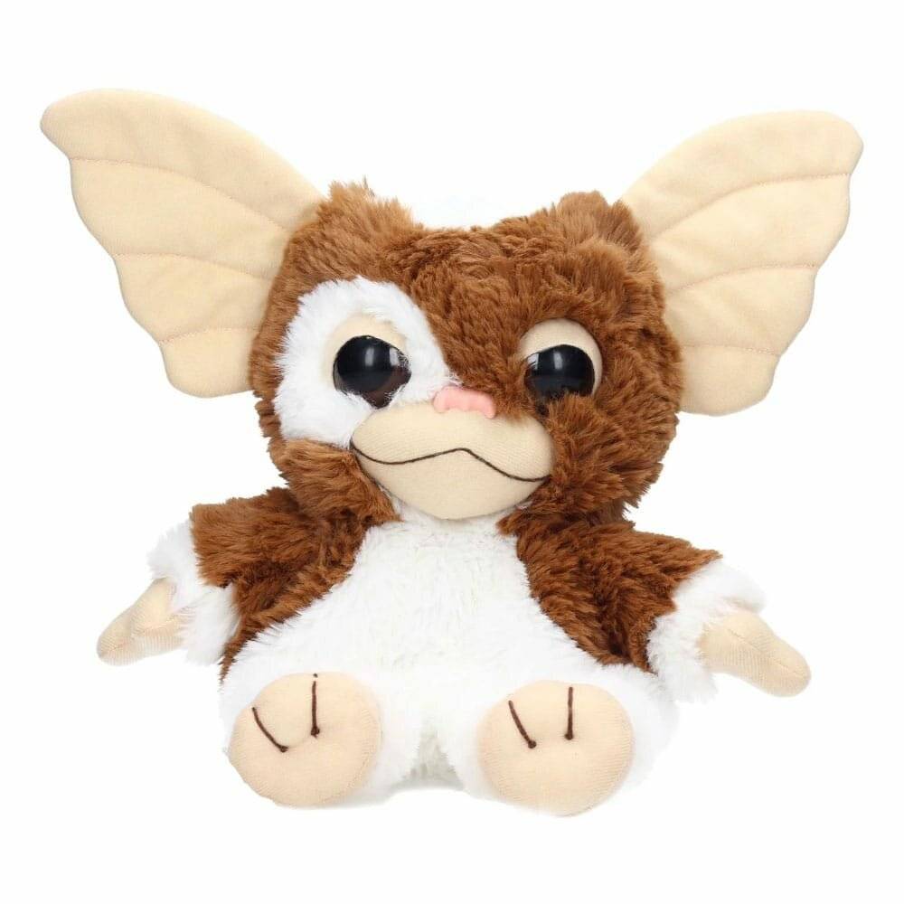 Braun-weißes plüschiges Gremlin-ähnliches Spielzeug mit großen cremefarbenen Ohren, großen Augen und winzigem sitzendem Körper auf weißem Hintergrund.