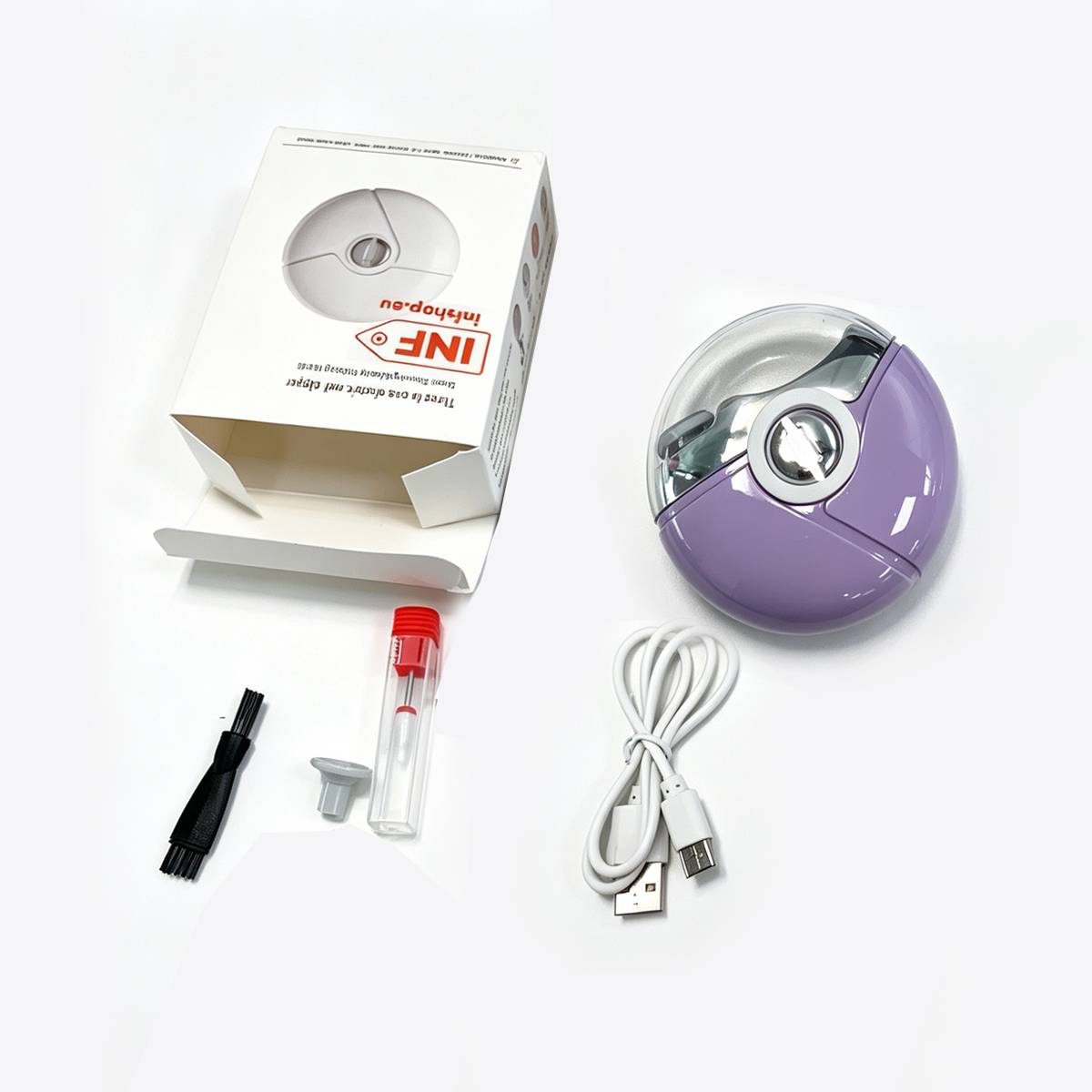 Kompakter elektrischer Fusselentferner in Violett und Transparent mit Karton, USB-Ladekabel, Reinigungsbürste und Ersatzkappe auf weißem Hintergrund ausgelegt.