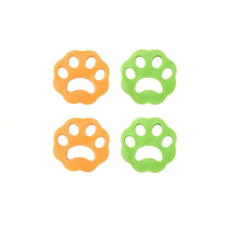 Vier Haustierpfotenaabdrücke in Form von Pfoten, zwei orange und zwei grün, jeweils mit ausgeschnittenem traurigem Gesicht auf weißem Hintergrund.
