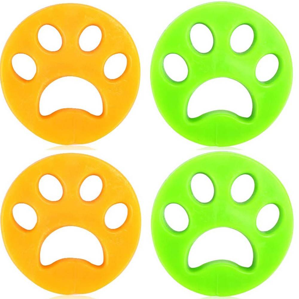 Vier bunte pfotenenförmige Fidget-Spielzeuge, zwei orange und zwei grün, jeweils mit offenem Mittelteil und Pfotenballen auf weißem Hintergrund.