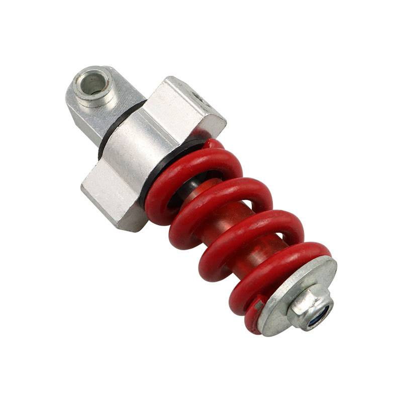 Ein roter Spiralfeder-Stoßdämpfer mit metallischer Befestigungshardware auf weißem Hintergrund.