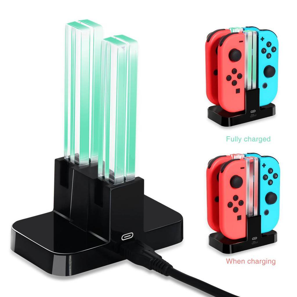 Nintendo Switch Joy-Con Ladedock mit leuchtenden UV-ähnlichen Lichtleisten; zwei Beispiele auf der rechten Seite zeigen vollständig aufgeladene und ladende Controller.