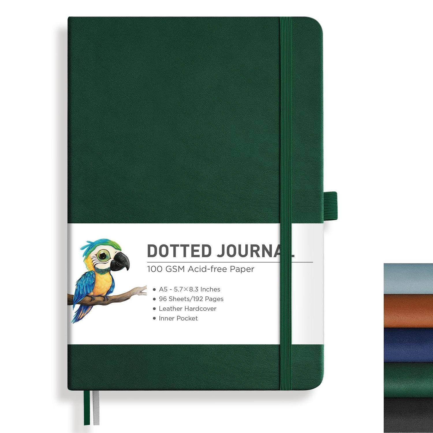 Dunkelgrünes gepunktetes Notizbuch mit Gummiband, beschriftet mit „DOTTED JOURNAL