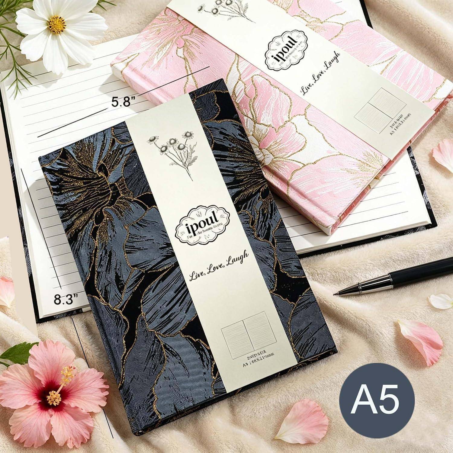 A5-Notizbücher und Tagebücher mit Blumenmotiven auf den Umschlägen in Schwarz, Rosa und Weiß, gezeigt mit Größenangaben 5,8