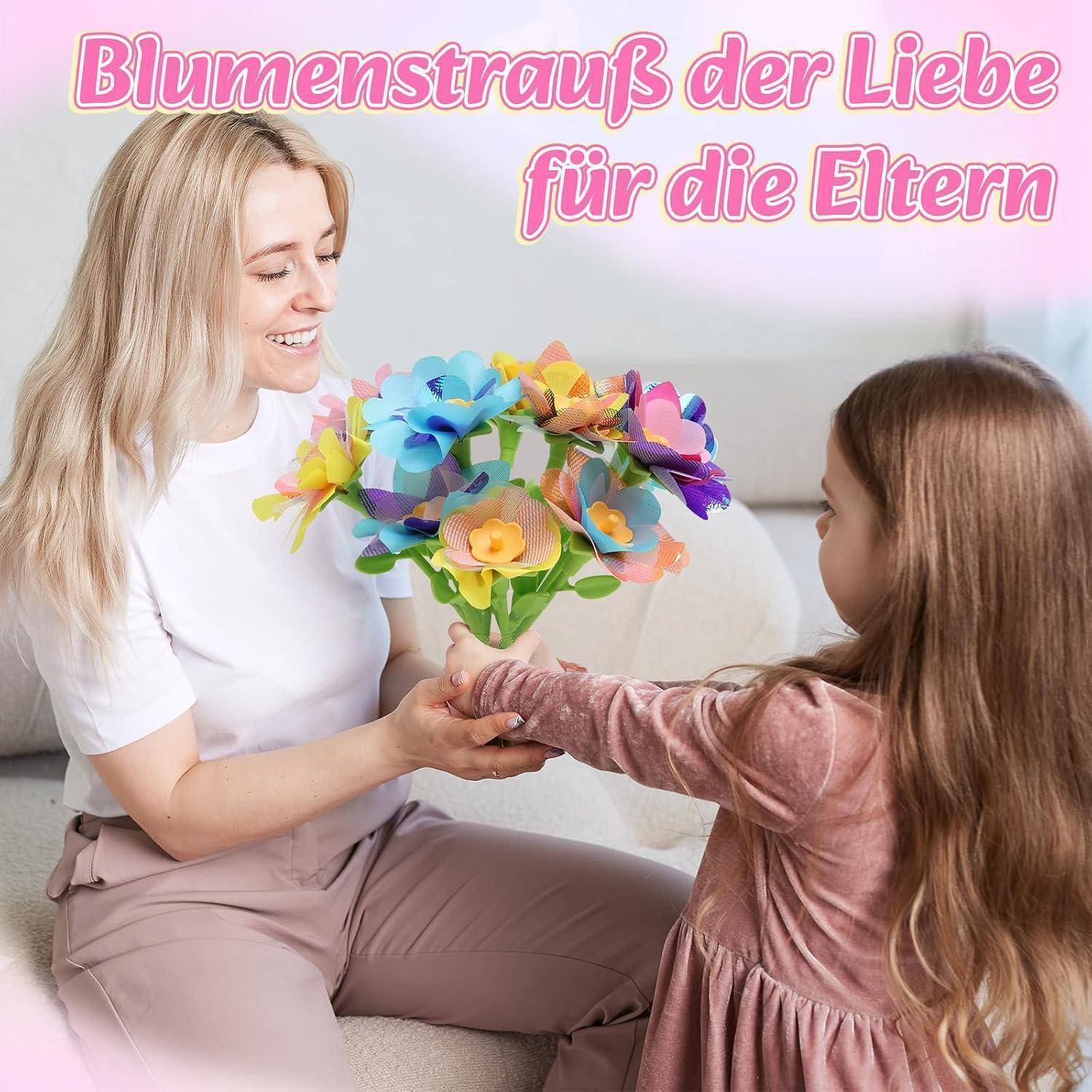 Mutter und Tochter lächeln, während sie einen bunten Papierblumenstrauß teilen; der Text sagt „Blumenstrauß der Liebe für die Eltern