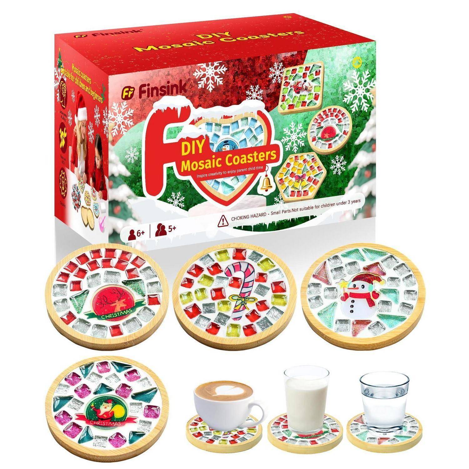 Boxed Finsink DIY-Mosaik-Untersetzer-Set mit vier dekorierten runden Untersetzern und Beispiel-Untersetzern, die eine Tasse, Milch und ein Glas halten.