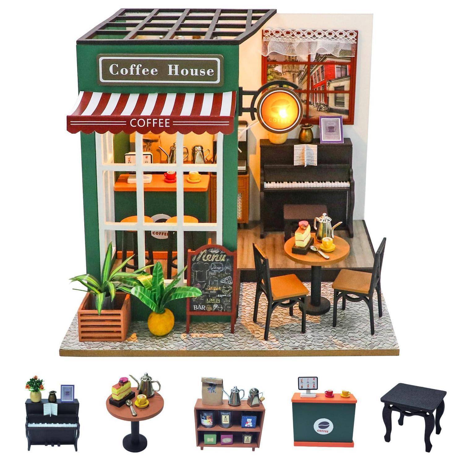 Miniaturkaffeehaus-Modell mit Ladenfront, Innenbestuhlung, Klavier, Tresen und separaten winzigen Möbelstücken, die unten ausgestellt sind.