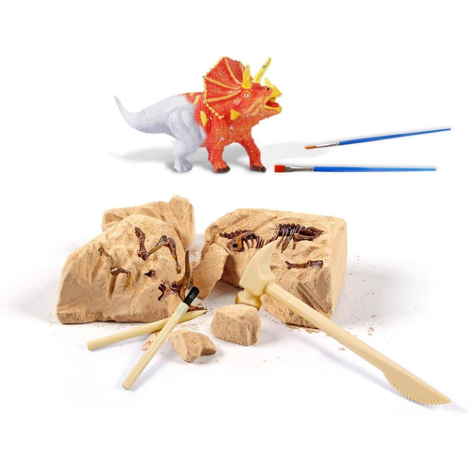 Spielzeug-Dinosaurier und Fossil-Ausgrabungsset mit einer kleinen rot-weißen Dinosaurier-Figur, zwei Bürsten und Steinblöcken mit eingebetteten Dinosaurier-Skeletten, die ausgegraben werden.