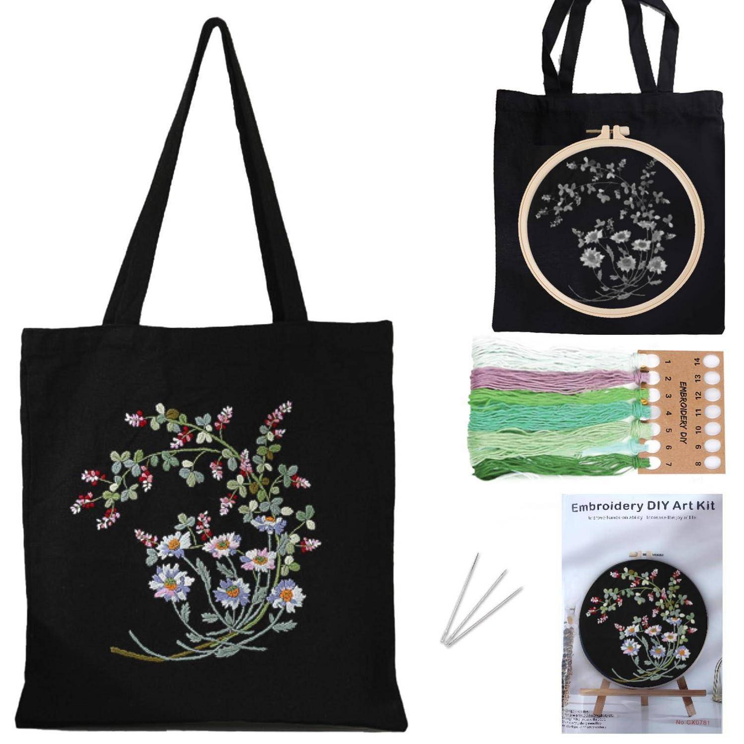 Schwarze Tragetasche mit Blumenstickerei, gezeigt mit passendem Stickrahmen-Set, farbigen Garnen, Nadeln und Anleitung für ein DIY-Handwerk-Set.