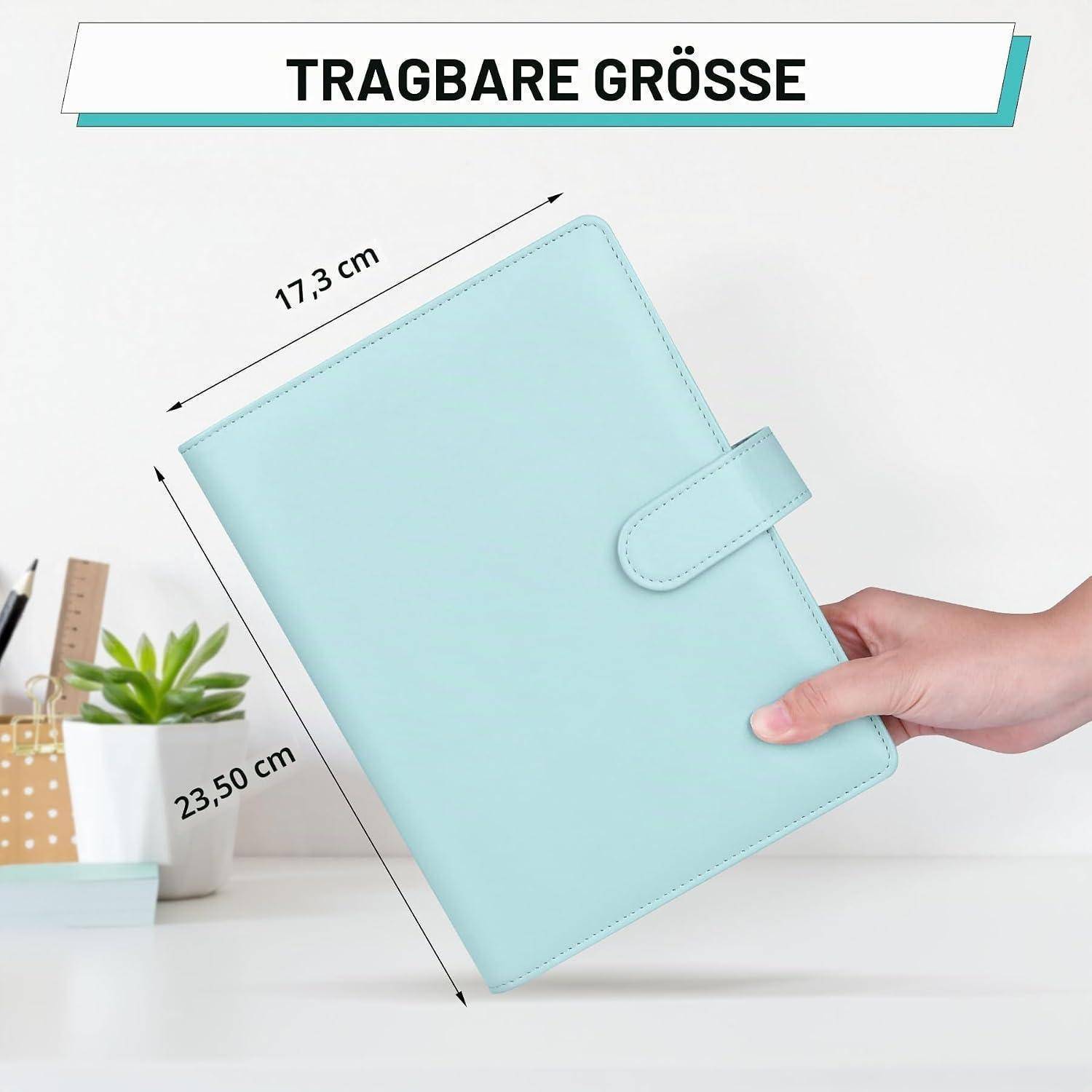 Hellblaues Notizbuch-Planer mit Verschlussriemen beschriftet mit „TRAGBARE GRÖSSE