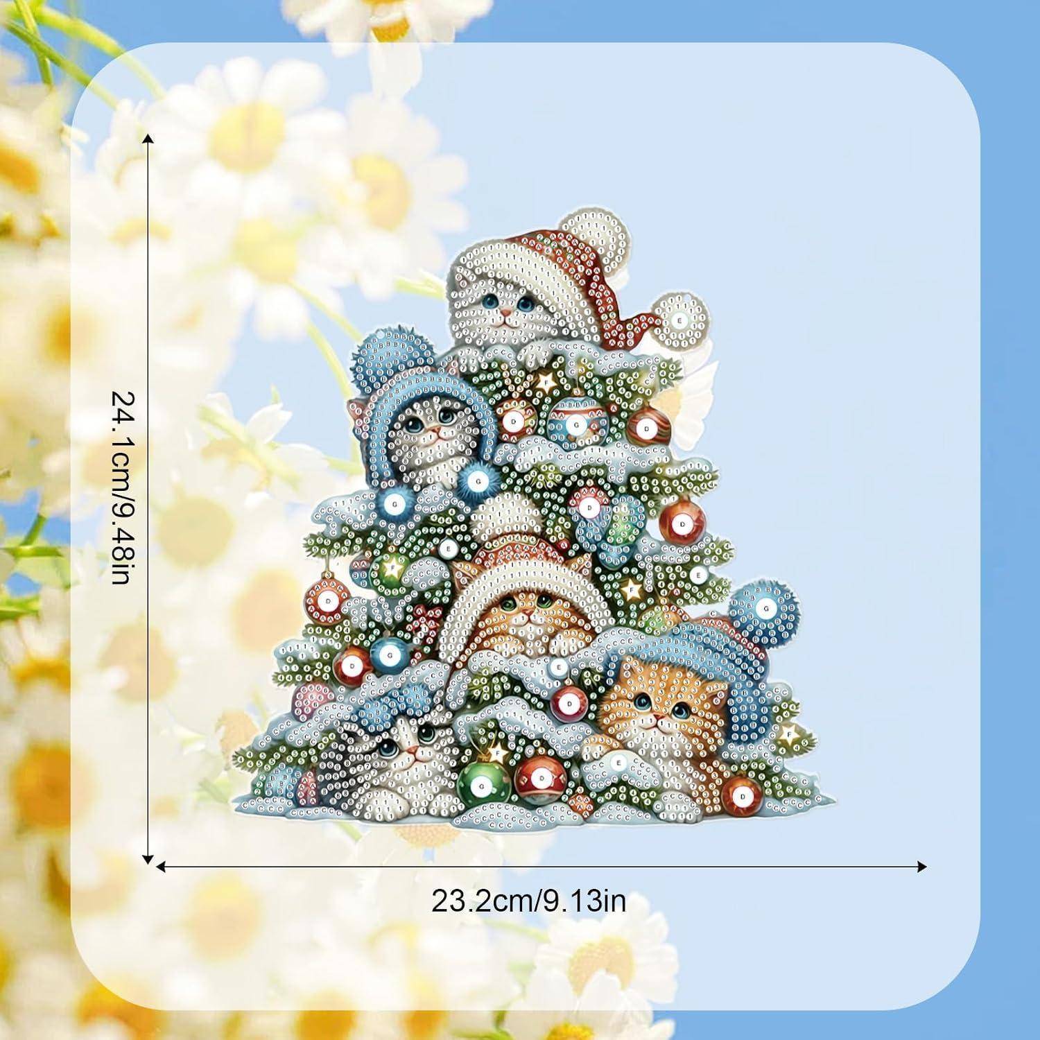 Dekorative katzenförmige Weihnachtsbaumskulptur mit drei Kätzchen, bedeckt mit bunten Ornamenten, gezeigt mit Größenetikett 24,1 cm hoch und 23,2 cm breit.