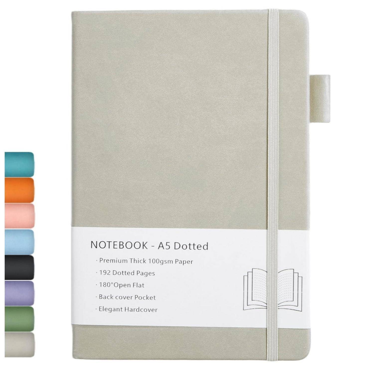 Beiges Hardcover-Notizbuch mit Gummiband und Registerkarte, beschriftet mit „NOTEBOOK - A5 Dotted