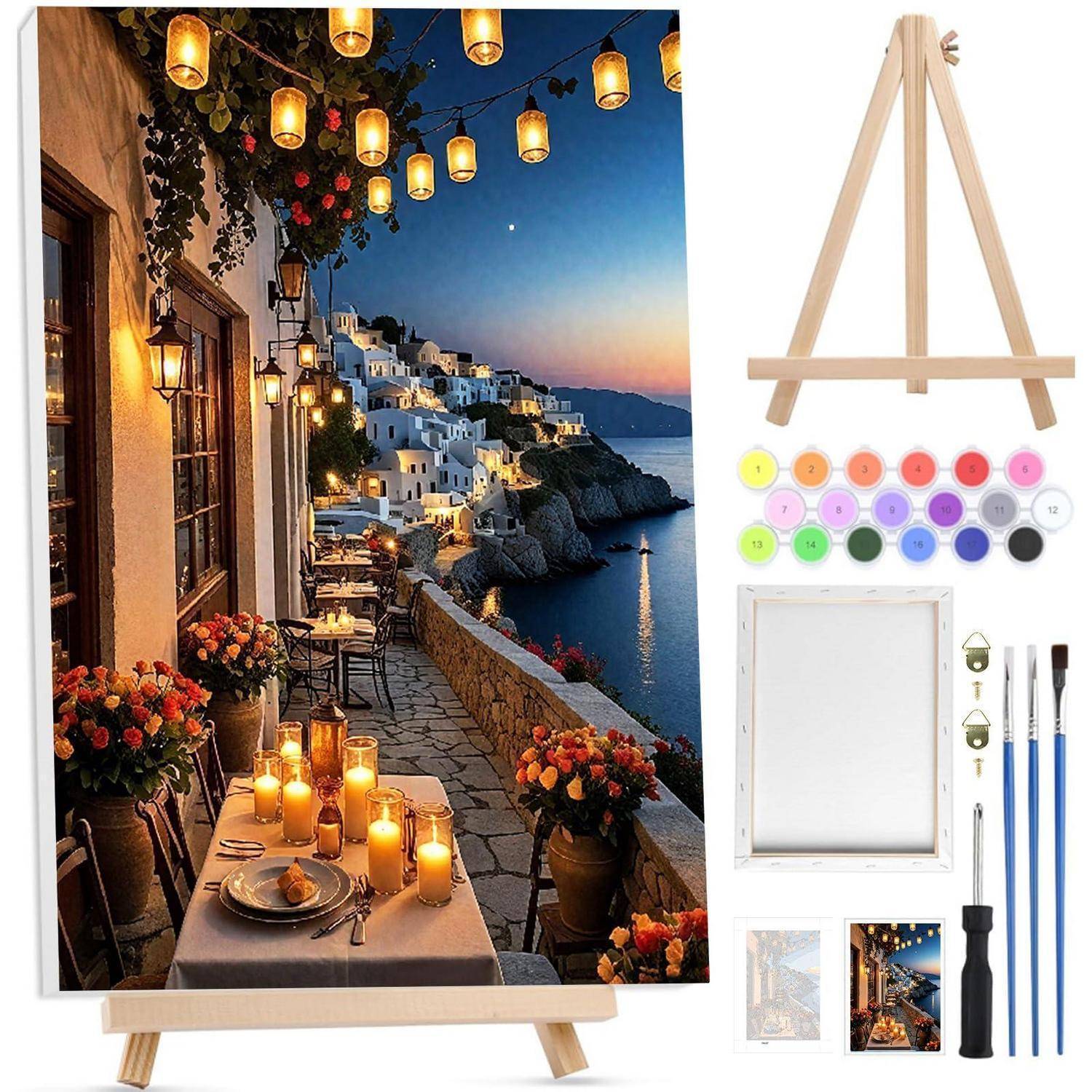 Ein Staffelei-Kunstset mit einer Leinwand, die ein Strandcafé in der Dämmerung zeigt, plus Farbtöpfe, Pinsel und Zubehör.