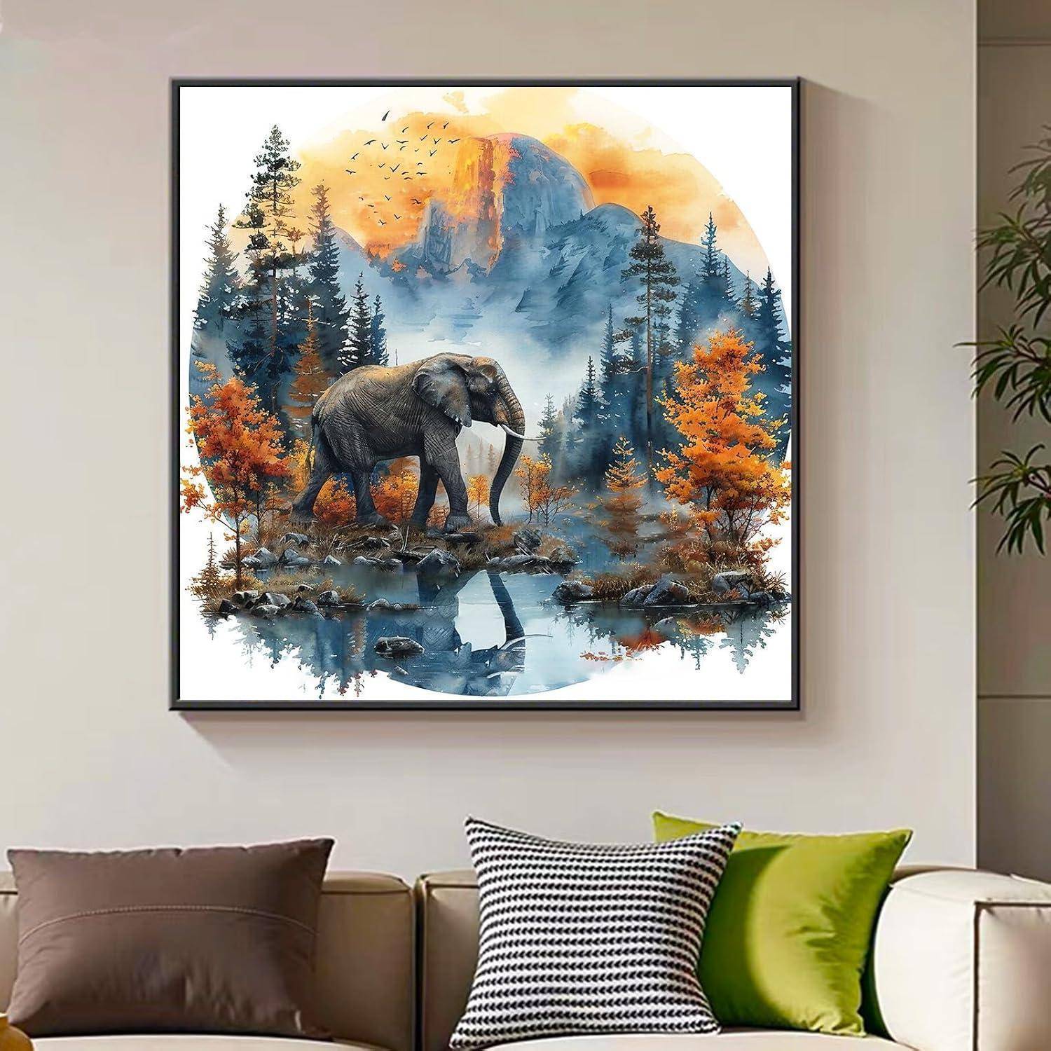 Gerahmte Wandkunst eines Elefanten in einem nebligen Wald mit Herbstbäumen und einem Berg, der sich im Wasser spiegelt, über einem Sofa.