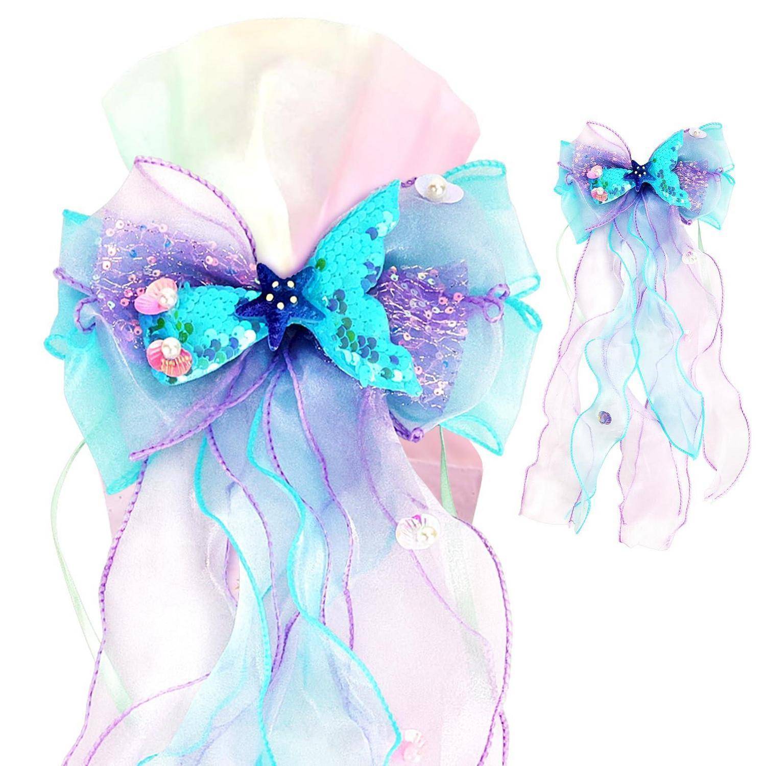 Pastellfarbenes Feenharnaccessoire mit einer großen schillernden Schleife und fließenden blauvioletten Bändern, gezeigt mit einer passenden kleineren Schleife.