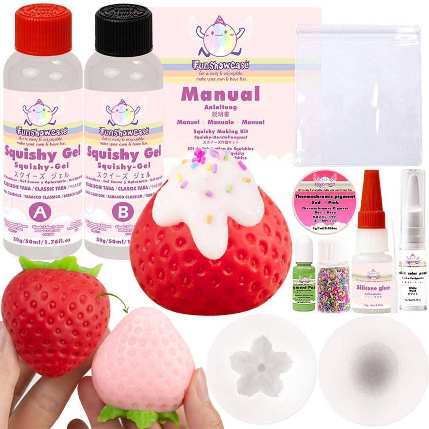 Bild eines erdbeerförmigen Squishy-Bastelsets mit zwei Gelflaschen, Anleitung, Formen, Farben, Klebstoff und einer fertiggestellten Erdbeerfigur.