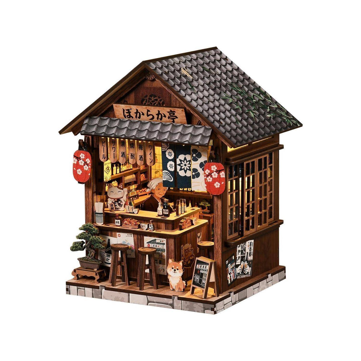 Miniatur-Ramen-Shop im japanischen Stil mit Laternen, Thekensitzplätzen und einem Schild mit der Aufschrift „ほかから亭