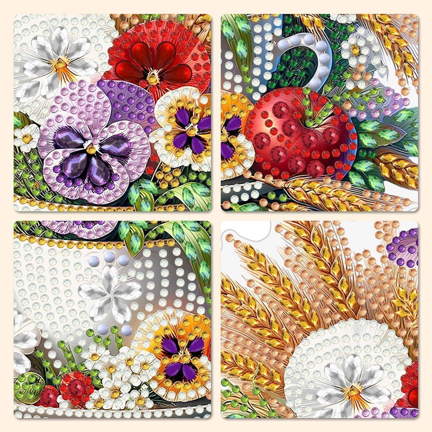 Vier farbenfrohe Diamantmalerei-Paneele mit Blumen, Obst und Weizen auf strukturierten Leinwänden, die dekorative Handwerkskunst mit floralem und Erntethema zeigen.