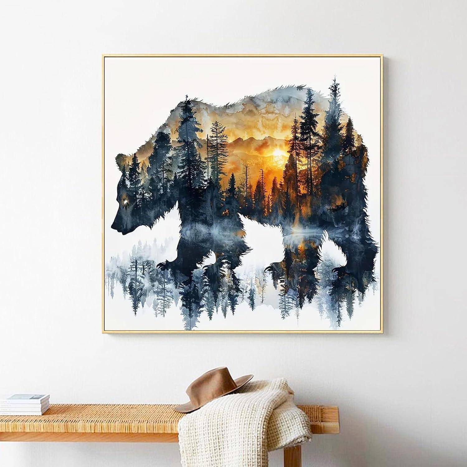 Kunstwerk mit Bärenschattenriss in Rahmen, gefüllt mit einer Wald- und Sonnenuntergangsszenerie über einer Bank mit Hut und zusammengefalteter Decke.