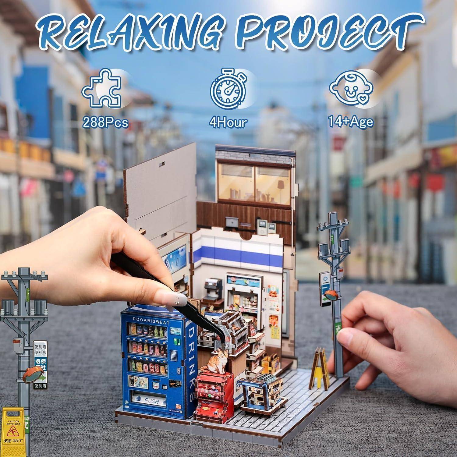 Hände montieren ein Miniatur-Convenience-Store-Modellbausatz mit der Bezeichnung „Relaxing Project