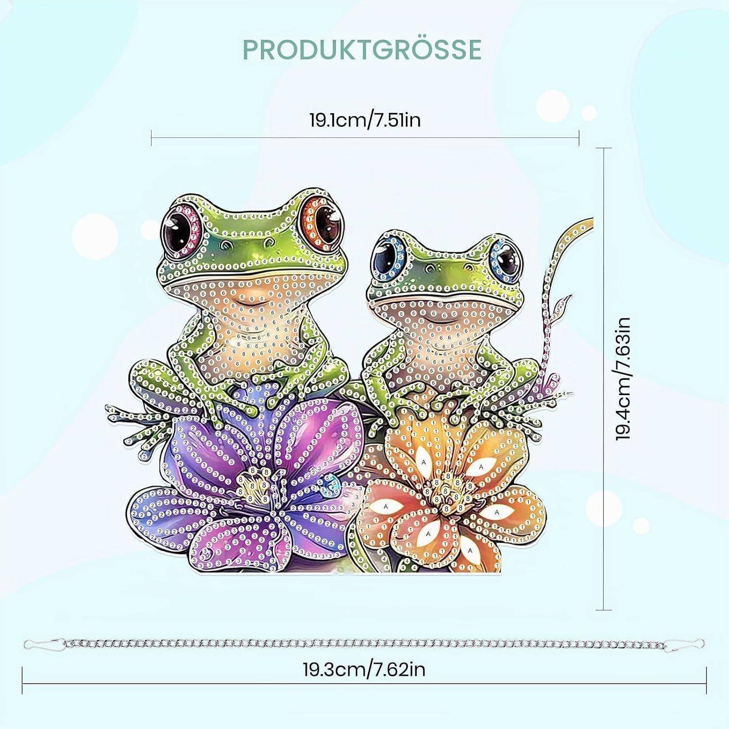Größentabelle für Produkte mit zwei geschmückten Fröschen auf Blüten, gekennzeichnet mit 19,1 cm Breite, 19,4 cm Höhe und 19,3 cm Basislänge.