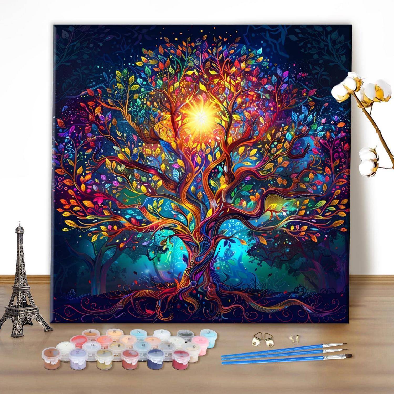 Bunte Malen-nach-Zahlen-Leinwand mit einem leuchtenden Fantasiebaum mit hellem sonnenähnlichem Zentrum, dargestellt mit Farben und Pinseln auf einem Tisch.