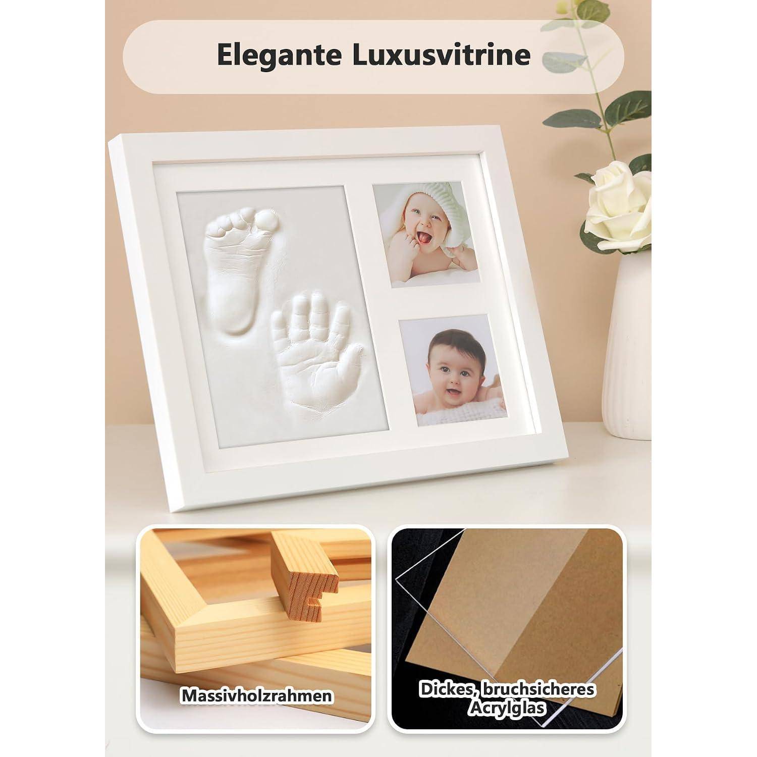 Werbebild eines weißen Abdruckrahmens für Babyhände und -füße mit zwei Babyfotografien, gekennzeichnet als robuster, eleganter Luxus-Erinnerungsrahmen.