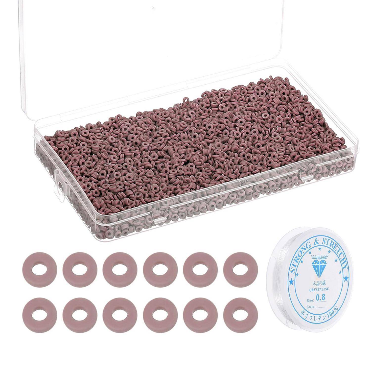 Transparente Box mit mauvefarbenen Silikon-Unterlegscheiben-Ringen, mit einer Musterreihe von Unterlegscheiben und einer Spule mit der Aufschrift „Strong & Stretchy