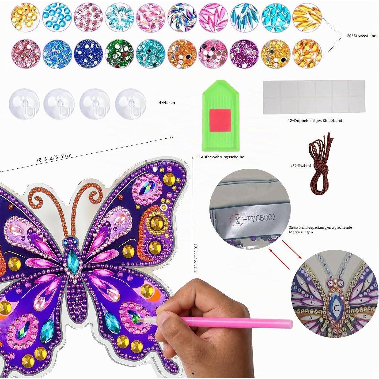 Diamond-Painting-Schmetterlings-Set mit farbigen Strasssteinen, Applikationsstift, Wachs, Tablett, Klebstofffolien und fertigem Schmetterlings-Design-Beispiel.