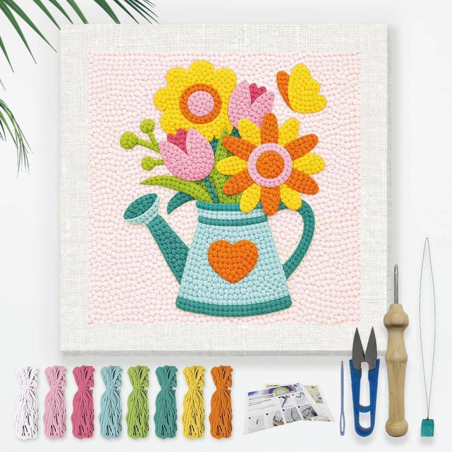 Buntes Bastelset-Bild mit einer Perlenkunst-Gießkanne gefüllt mit Blumen, mit Garn-/Perlenvorräten und Werkzeugen darunter angeordnet.