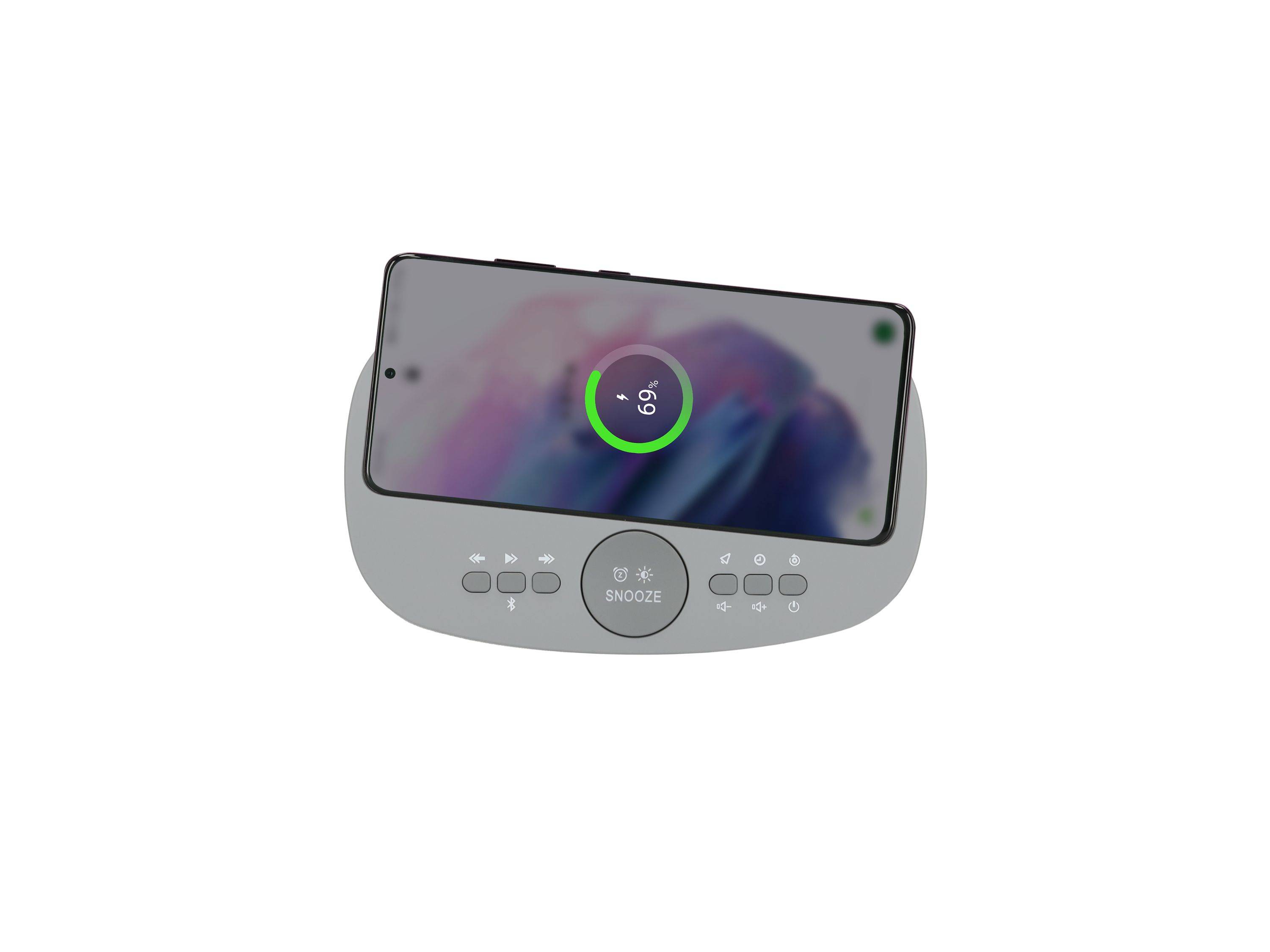 Digitaler Wecker mit einem Telefon oben drauf, das einen Ladeanzeiger von 69 % zeigt, und eine zentrale Schlummertaste auf der Dockingstation.