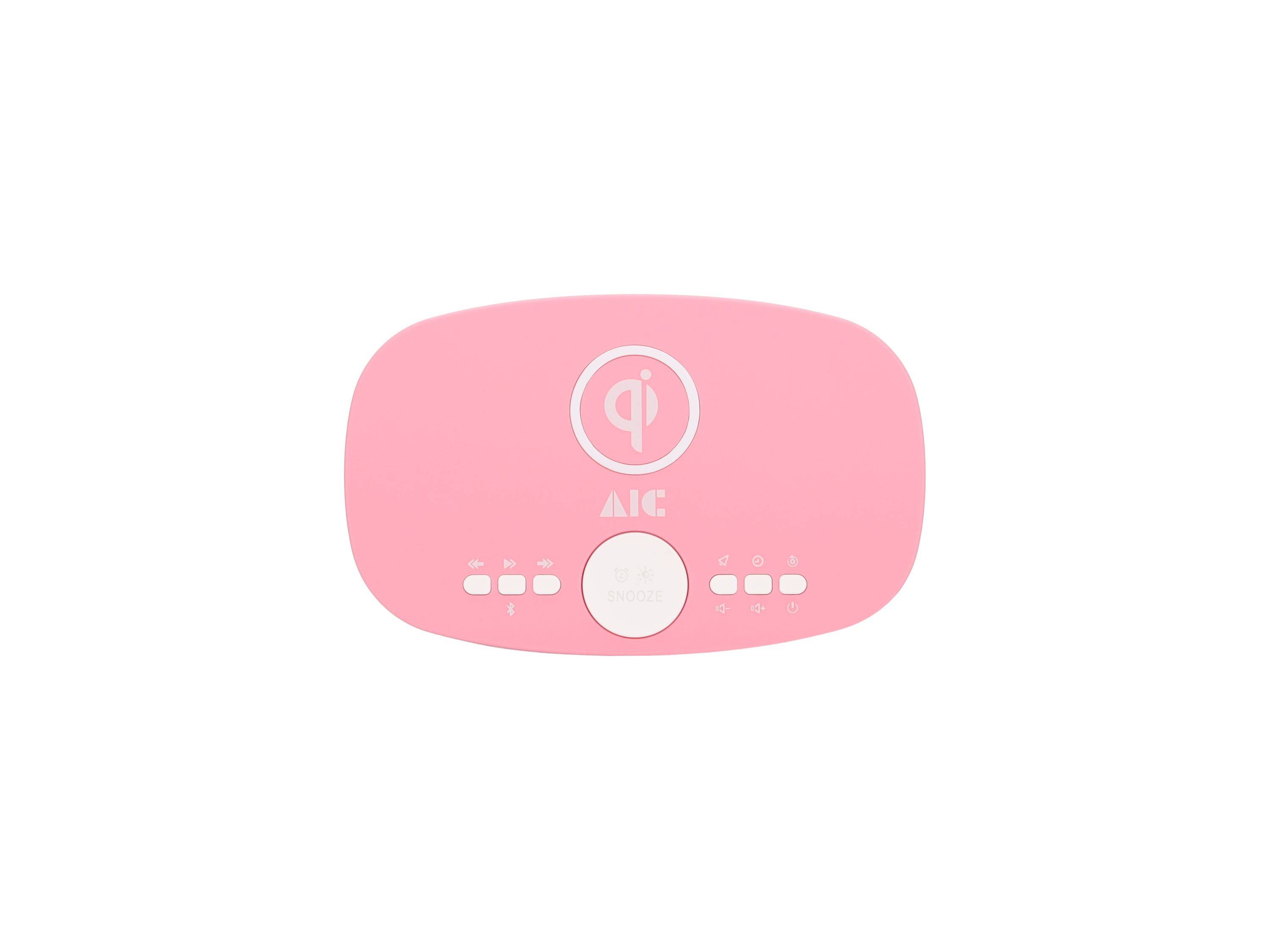 Rosa AIC-Gerät mit Qi-Wireless-Charging-Symbol, zentralem rundem Knopf und kleinen Anzeigeleuchten/Tasten auf weißem Hintergrund.