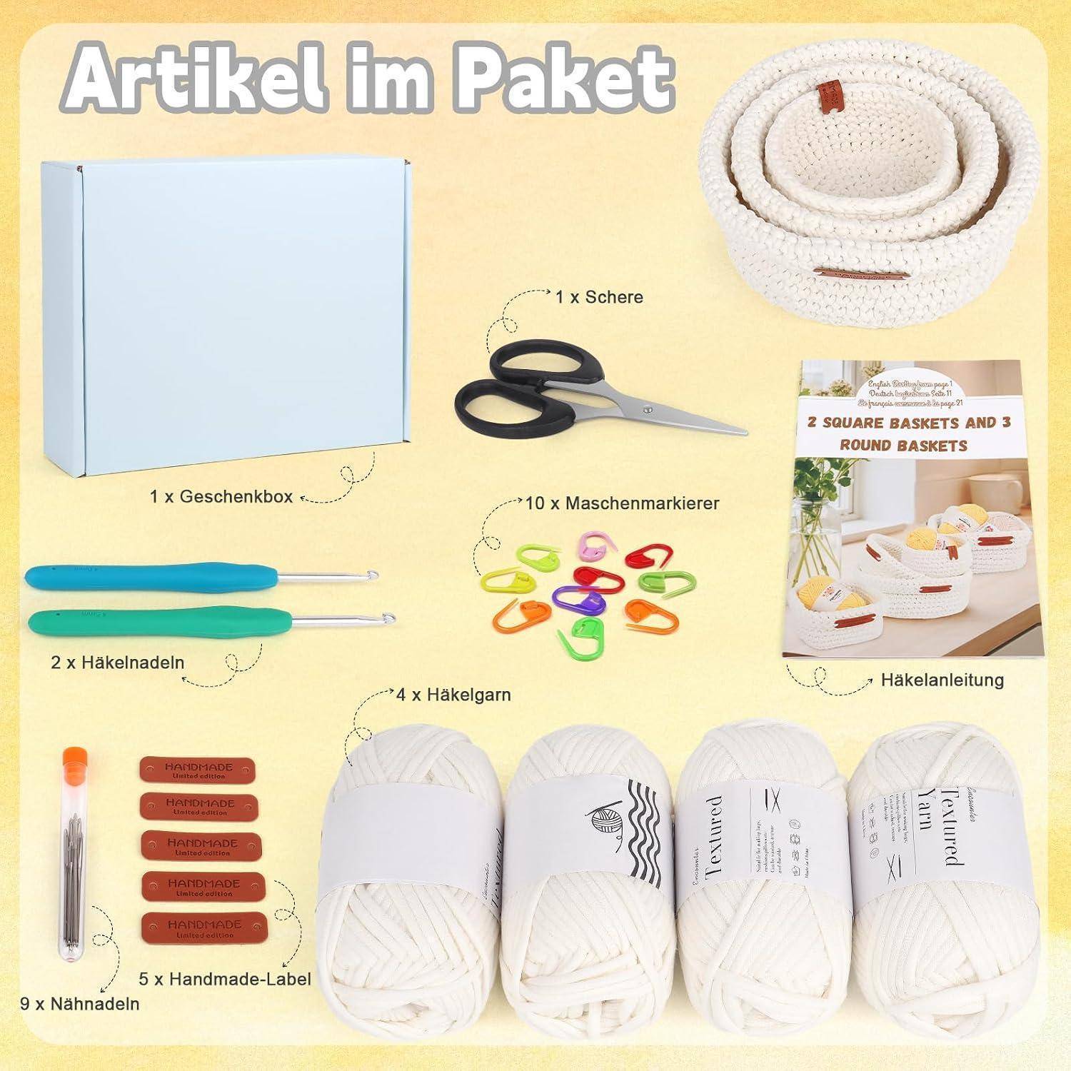 Inhalt des Körbchen-Bastelsets: Geschenkbox, Korbschnur, Schere, Häkelnadeln, Maschenmarkierer, Garn, Nadeln, handgefertigte Etiketten und Anleitung.