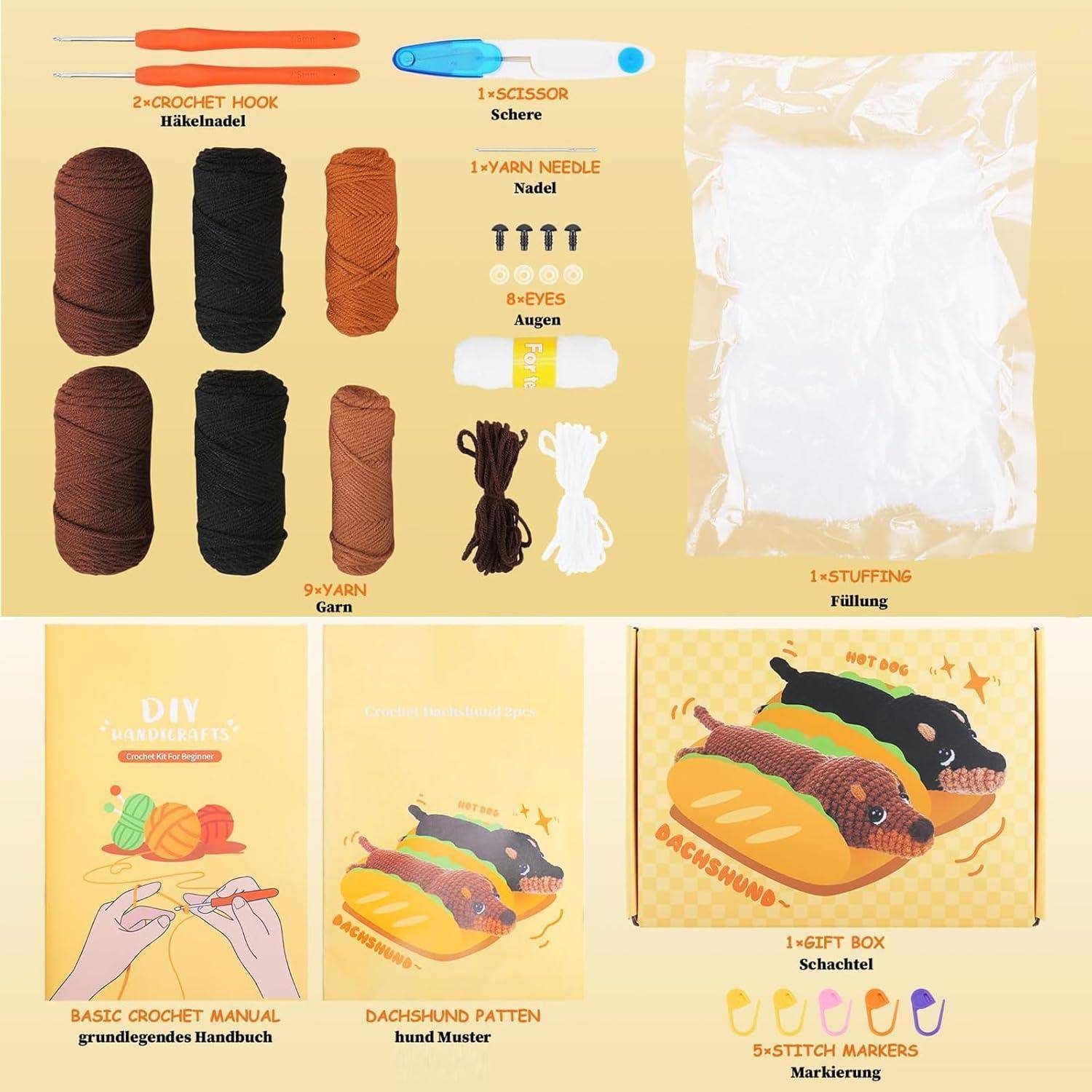 Häkelset-Inhalte ausgelegt: Häkelhaken, Schere, Wollnadel, Sicherheitsaugen, Füllmaterial, Wollknäuel, Anleitungshandbuch, hundeförmige Geschenkbox und Maschenmarkierer.