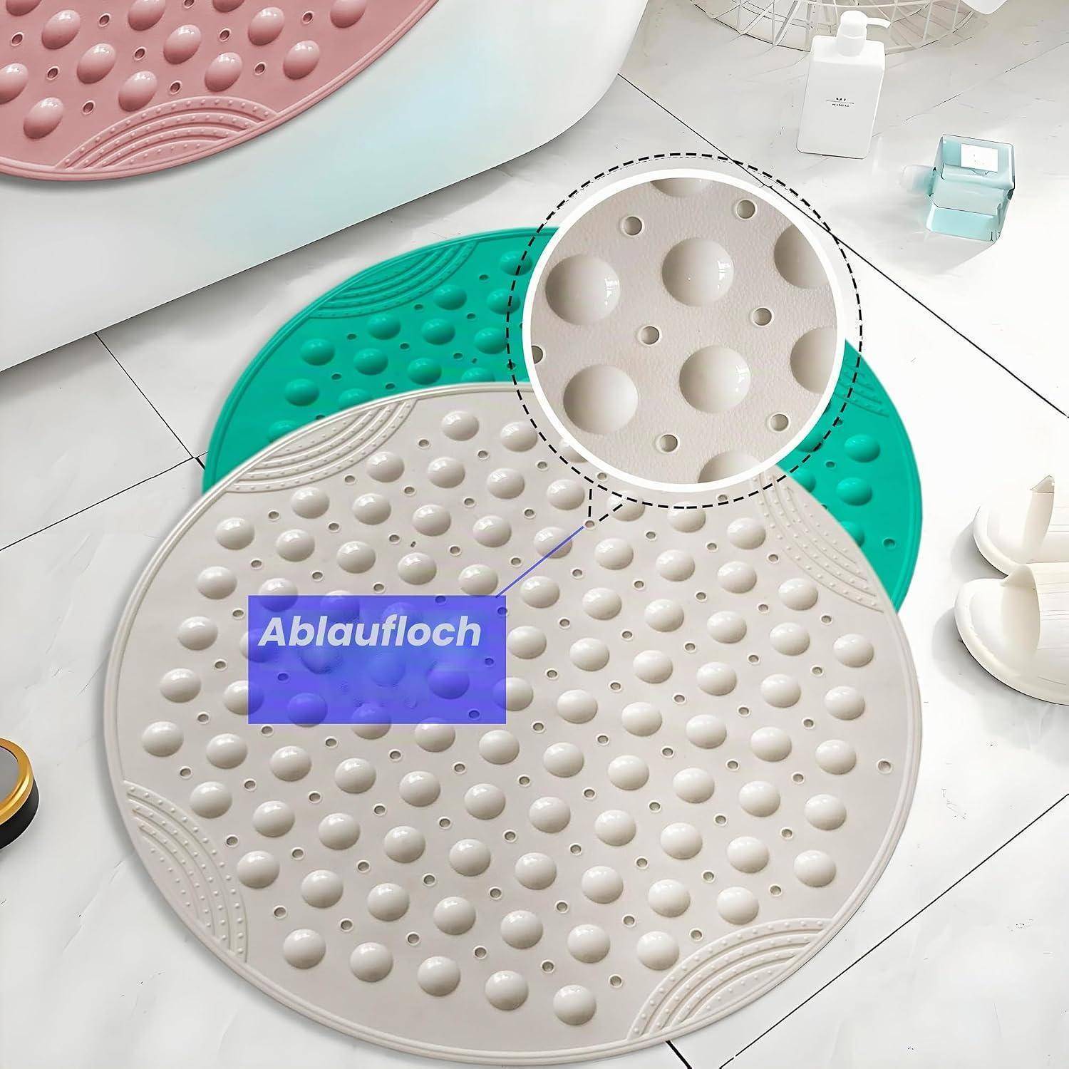 Runde Silikonbadematte mit erhabenen Saugnapfnoppen; eine ist mit „Ablaufloch