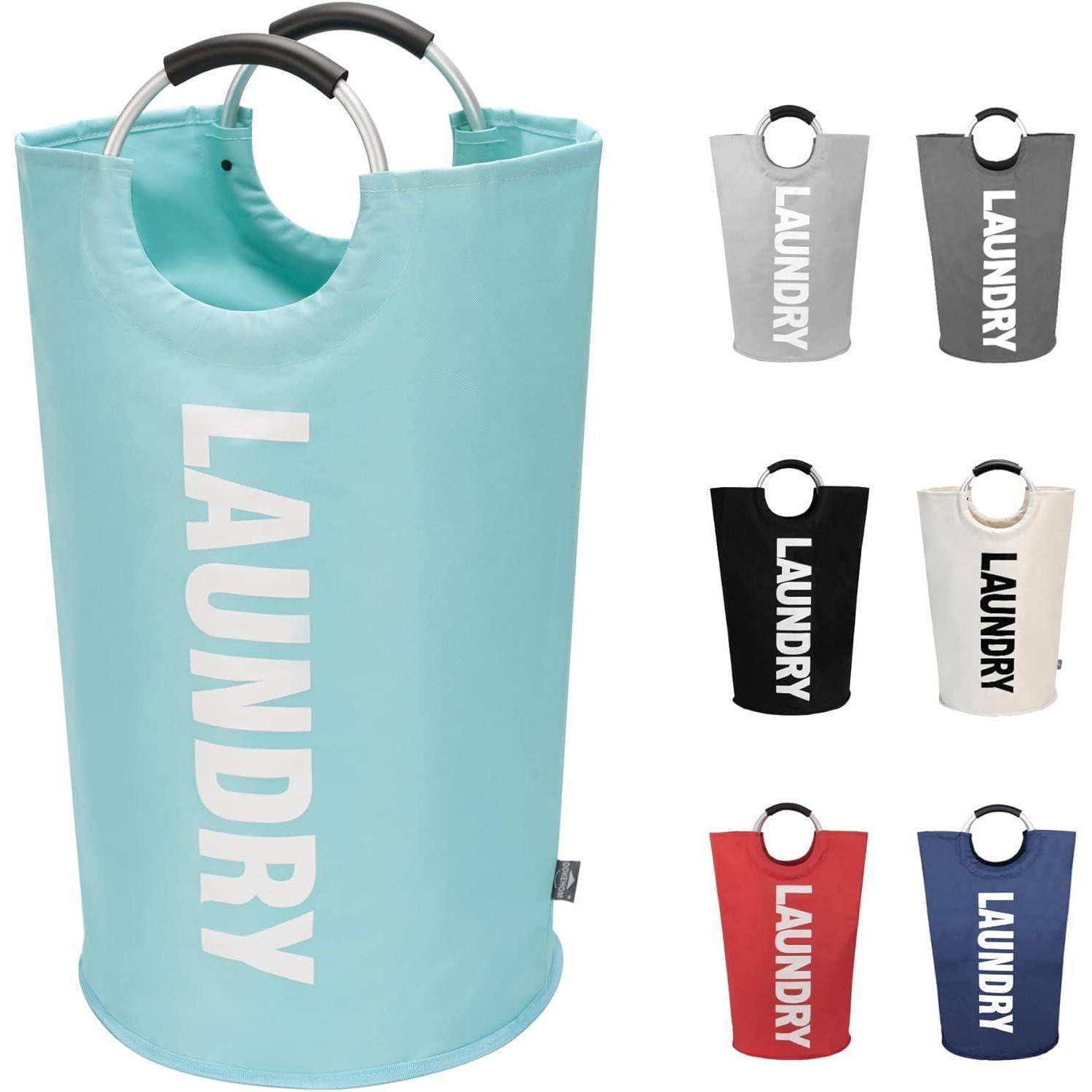 Zusammenklappbarer zylindrischer Wäschekorb mit Ringgriffe und großem 'LAUNDRY'-Druck; in Petrol dargestellt, mit Farboptionen auf der rechten Seite angezeigt.