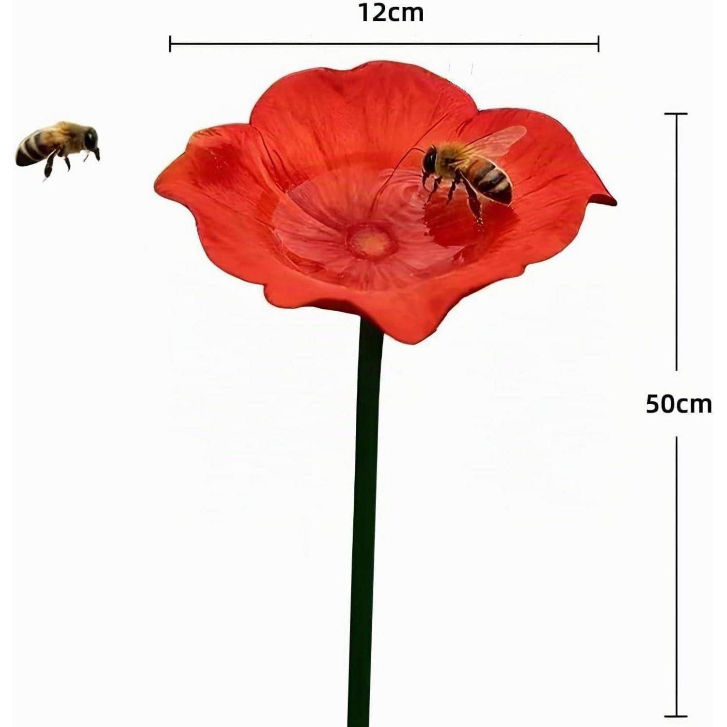 Rote blütenförmige Bienentränke auf einem Stiel, dargestellt mit zwei Bienen und beschrifteten Abmessungen von 12 cm Breite und 50 cm Höhe.
