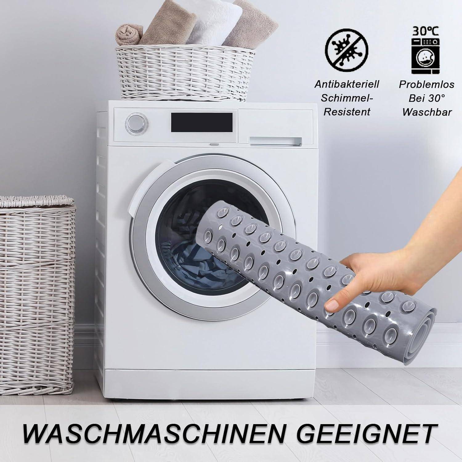 Graue rutschfeste Matte vor einer Waschmaschine, mit Text der besagt „WASCHMASCHINEN GEEIGNET