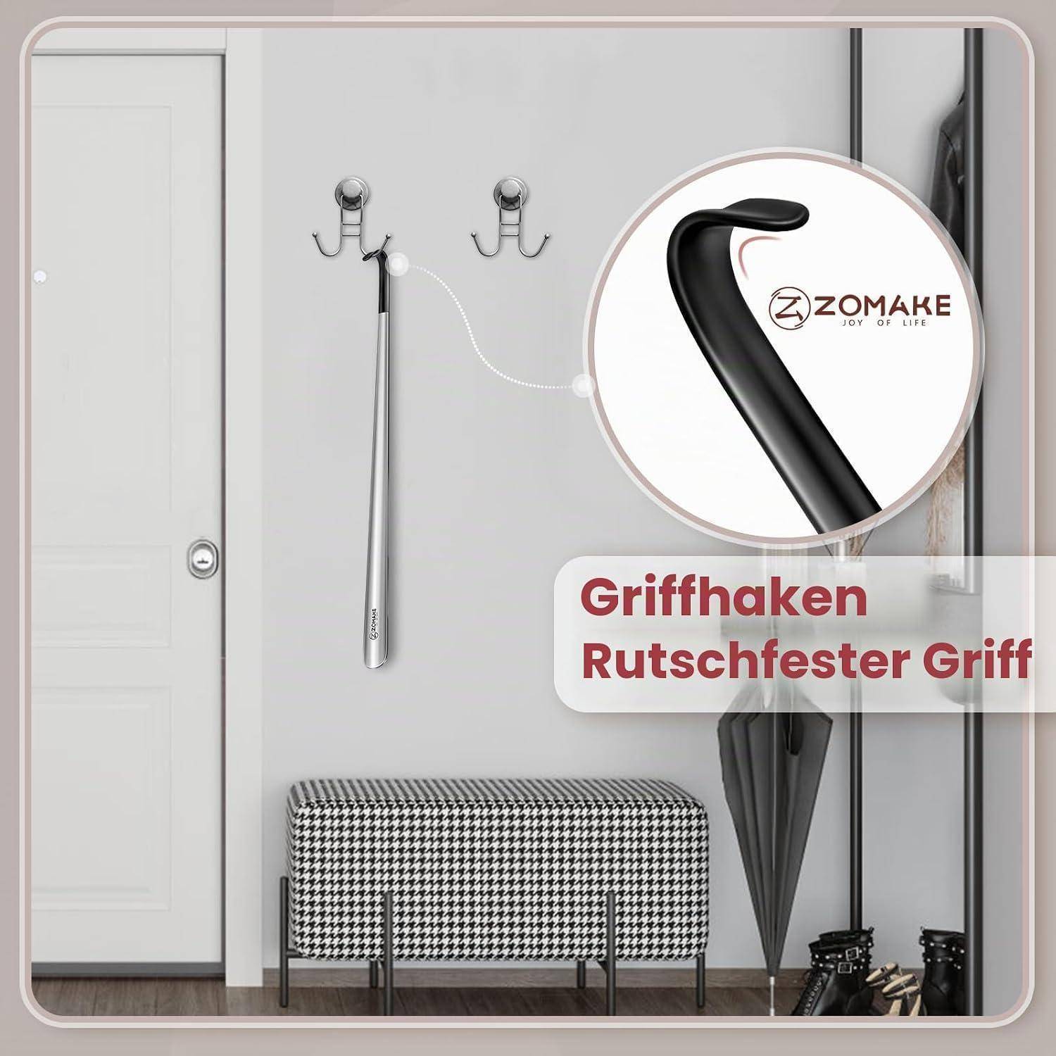 Wandmontierter silberner Haken mit schwarzem rutschfestem Griff, gezeigt in einer Raumgestaltung mit deutschem Text „Griffhaken Rutschfester Griff