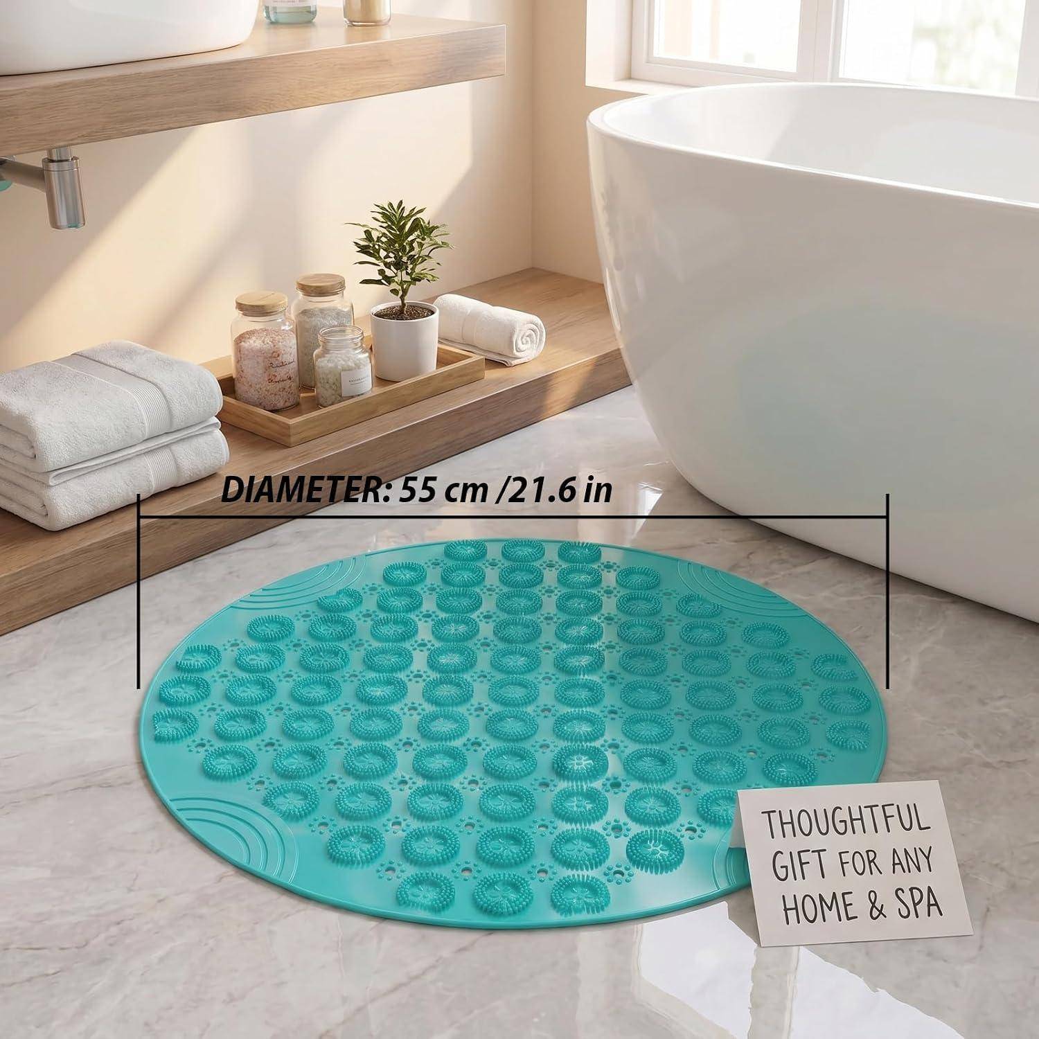 Türkisfarbene runde Badematte mit erhabenen Saugnapf-Punkten im Badezimmer, beschriftet mit „DURCHMESSER: 55 cm / 21,6 Zoll