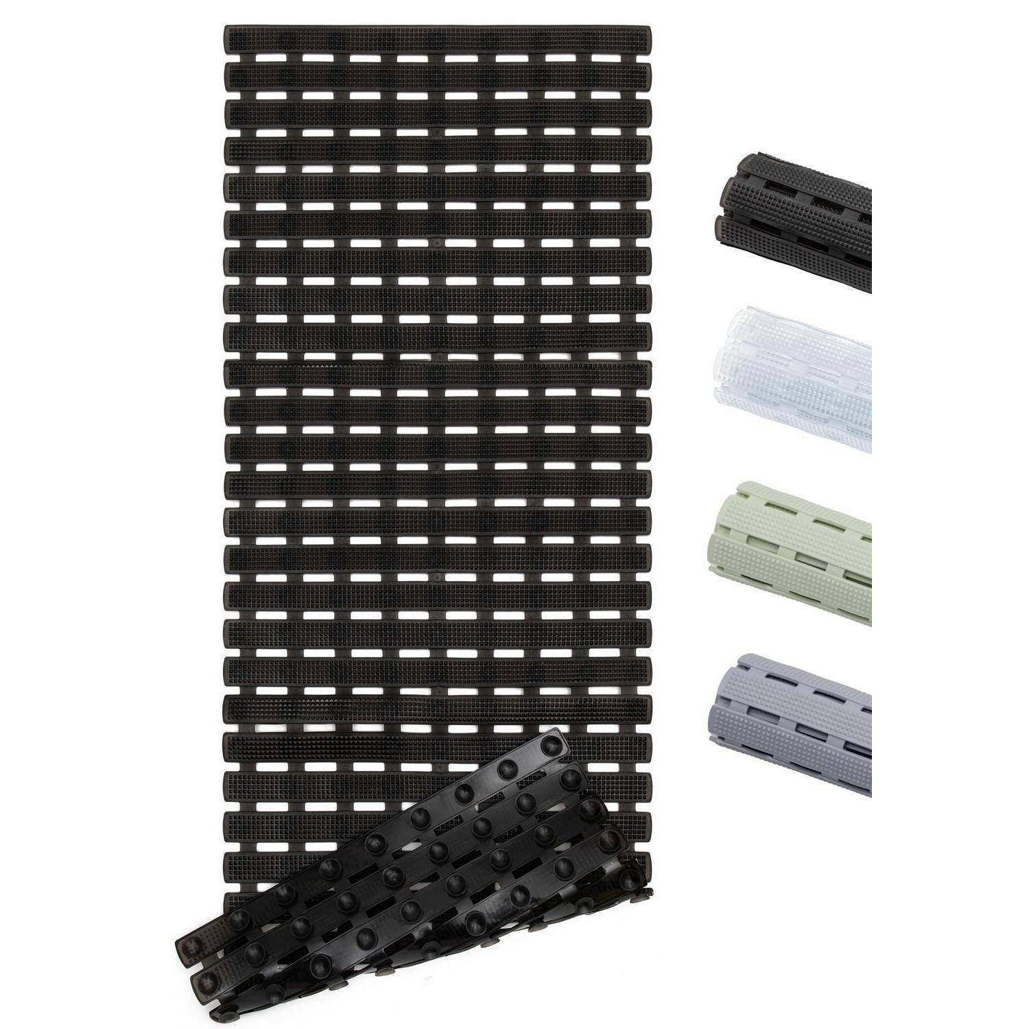 Schwarze modulare Kunststoffmattenpanel mit Schlitzrastermuster, gezeigt mit gefalteten Musterstücken in Schwarz, Weiß, Grün und Grau auf weißem Hintergrund.